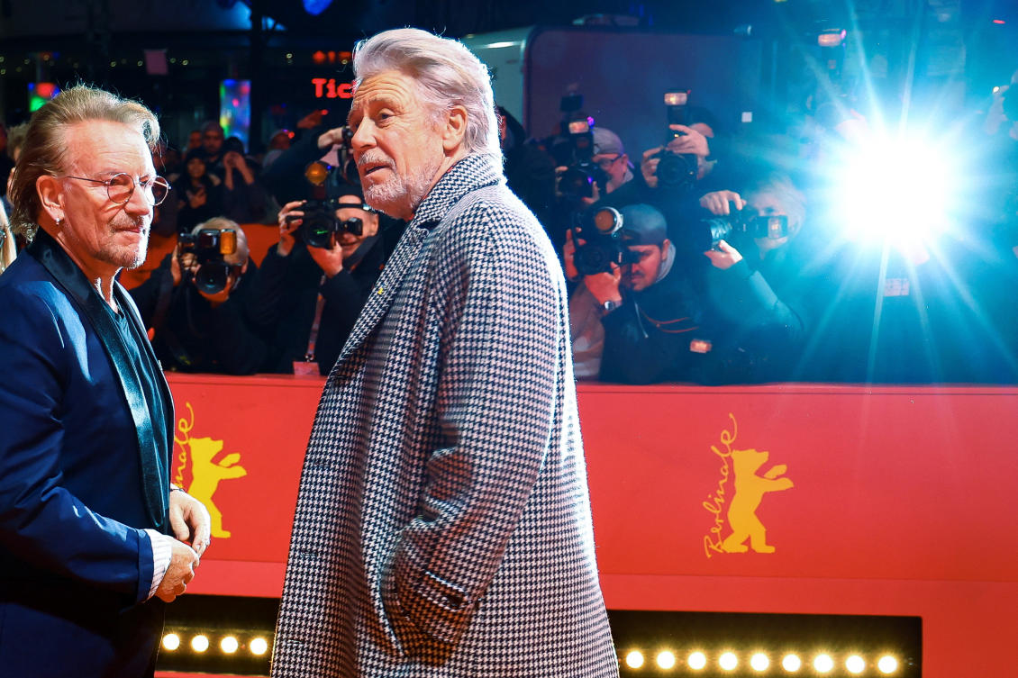 Bono and Adam Clayton of U2 attend the screening of the documentary movie 'Kiss the Future' at the 73rd Berlinale International Film Festival in Berlin. (Reuters)