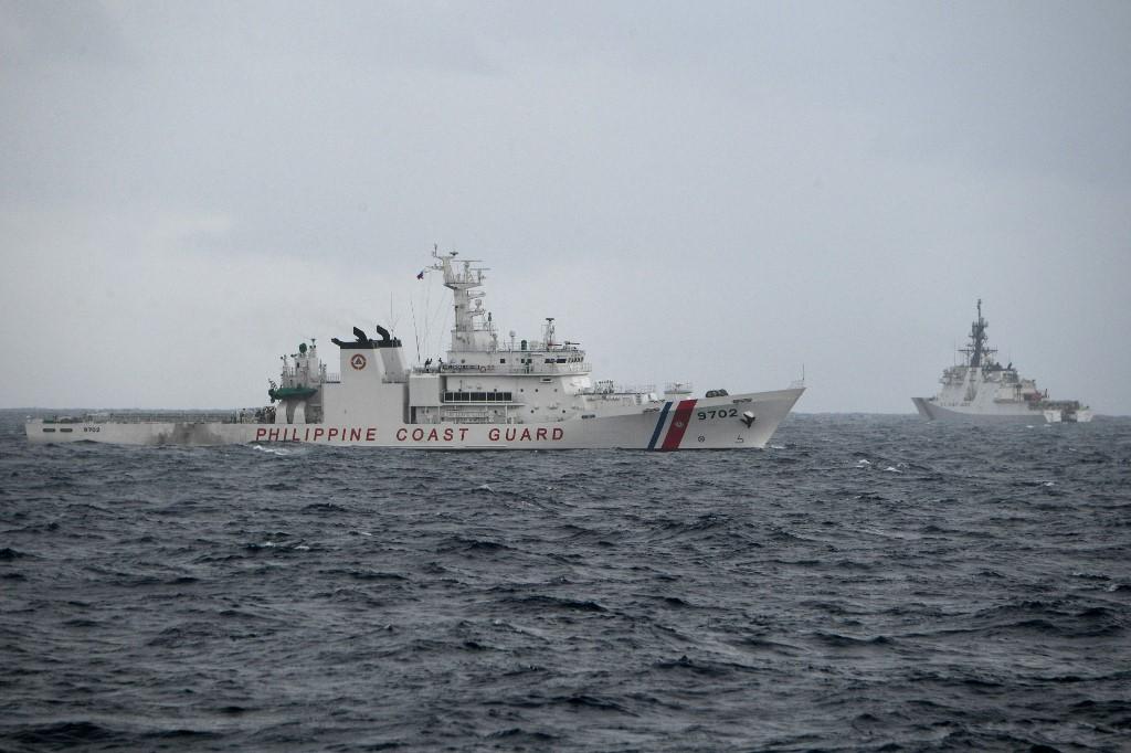 Philippine coast guard ship Melchora Aquino, left, and US coast guard cutter Midgett maneuver during an exercise in the vicinity of the South China sea on Sept. 3, 2022. (AFP)