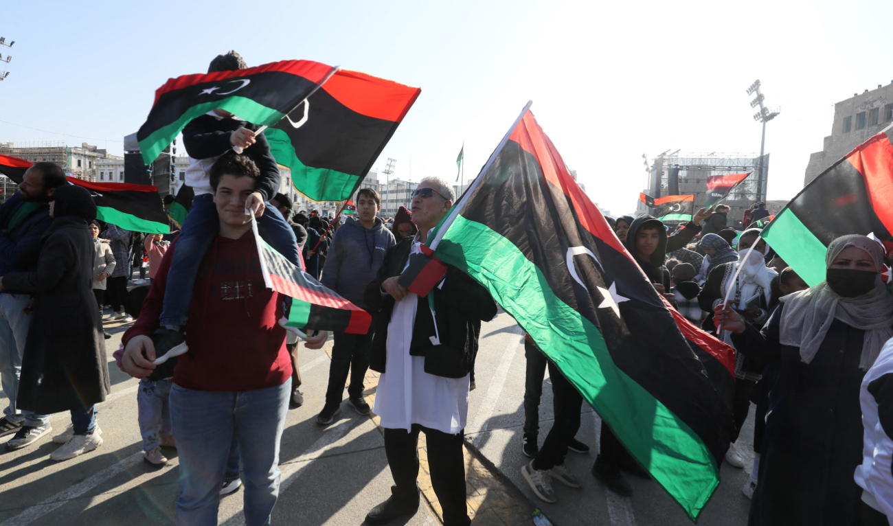 Libyans gather at the Martyrs' Square in Libya's capital Tripoli on February 17, 2023, as they commemorate the 12th anniversary of the uprising that toppled Muamer Qaddafi. (AFP/File)