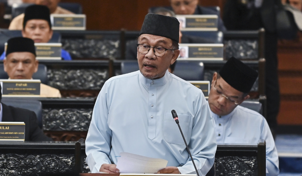 Prime Minister and Finance Minister Anwar Ibrahim delivers his 2023 budget speech at the parliament in Kuala Lumpur Friday. (Malaysia’s Department of Information via AP)