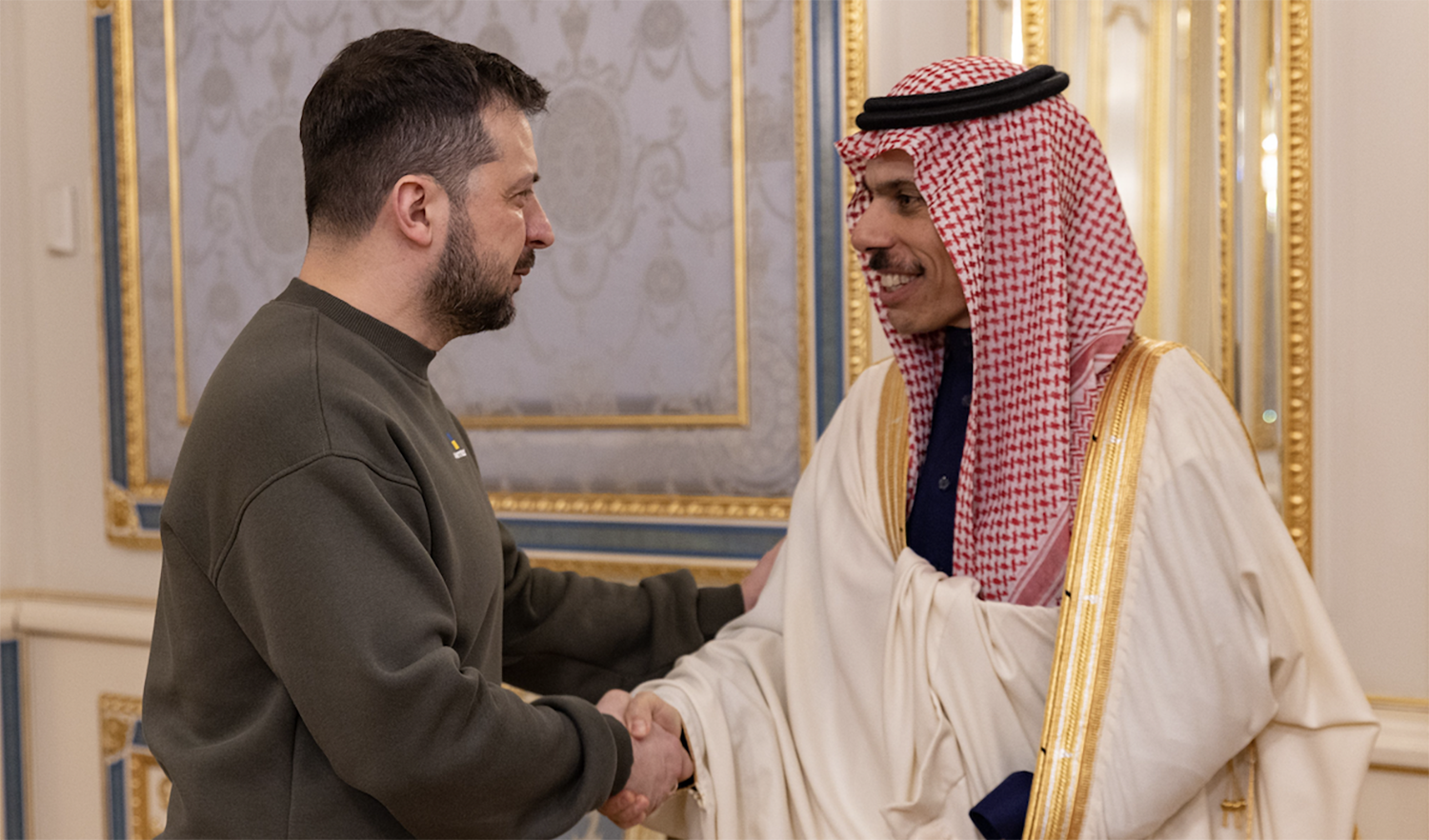 Saudi Arabia’s Foreign Minister Prince Faisal bin Farhan shakes hands with Ukraine’s president in Kyiv on February 26, 2023. (SPA)