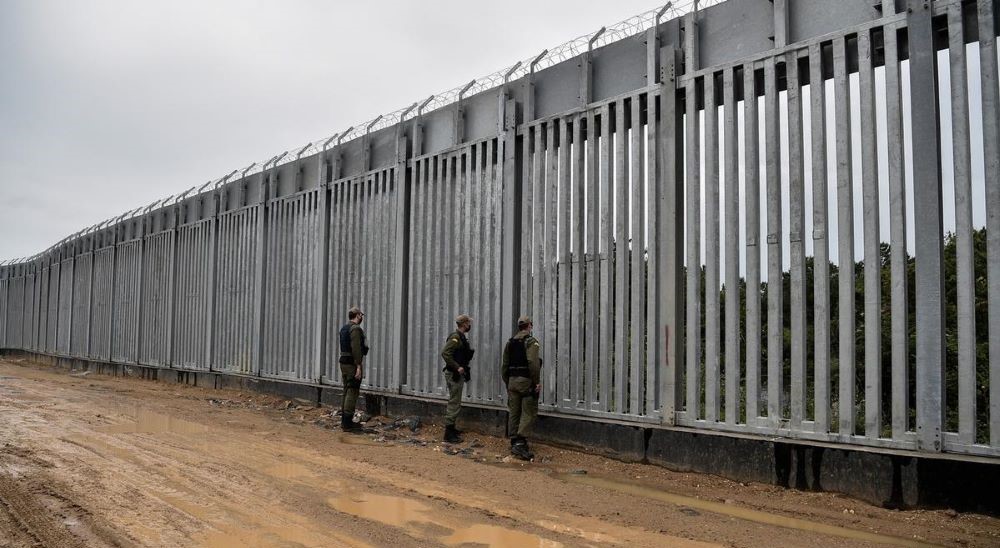 Greek guards patrol the border fence along the Evros river. (AFP)