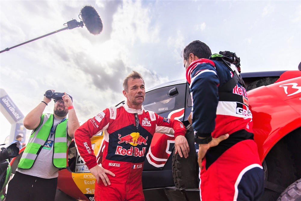 Rivals Loeb, left, and Nasser Al-Attiyah chat during the Prologue of the 2023 Abu Dhabi Desert Challenge. (DPPI)