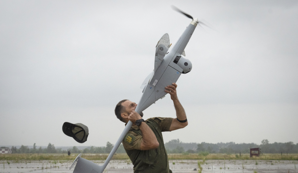 A Ukrainian soldier launches FlyEye WB Electronics SA, a Polish reconnaissance drone, which is in service with the Ukrainian army, in Kyiv region, Ukraine, Tuesday, Aug. 2, 2022. (AP)