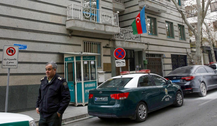 A policeman stands guard in front of the Azerbaijan embassy in Tehran on January 27, 2023, following an attack. (AFP)
