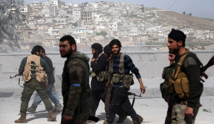 Turkish-backed Syrian rebels gather in the city of Afrin in northern Syria. (AFP)