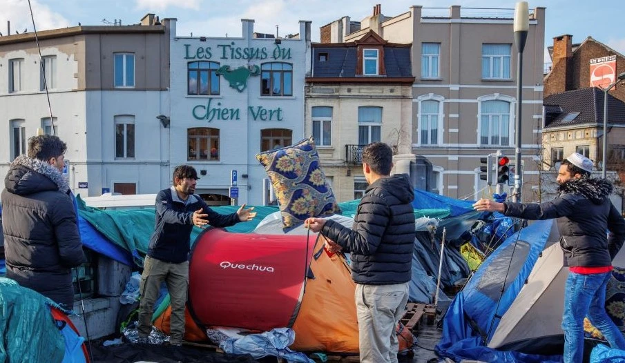 Refugees at a makeshift camp outside the Petit Chateau reception center in Brussels, Belgium, Jan. 17, 2023. (AP Photo)