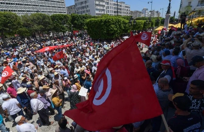 Tunisians are torn between awareness of their country’s dire needs and their acute sense of pride. (AFP)