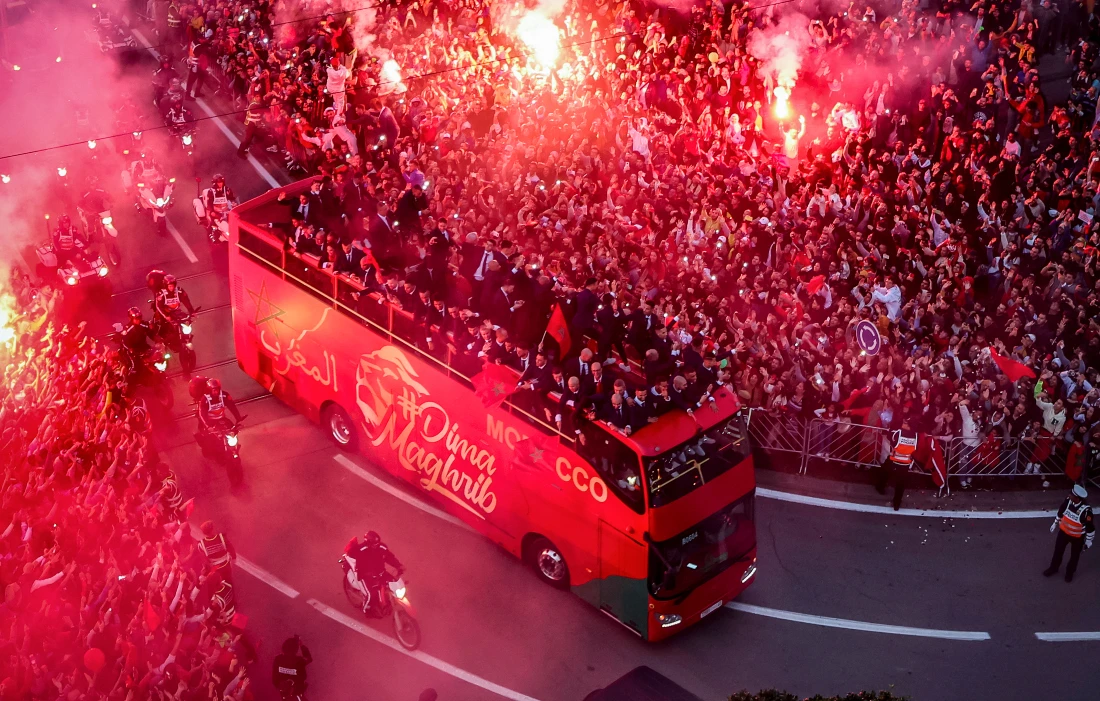 Supporters cheer as Morocco's national football team arrives to the center of the capital Rabat, after the Qatar 2022 World Cup. (File/AFP)