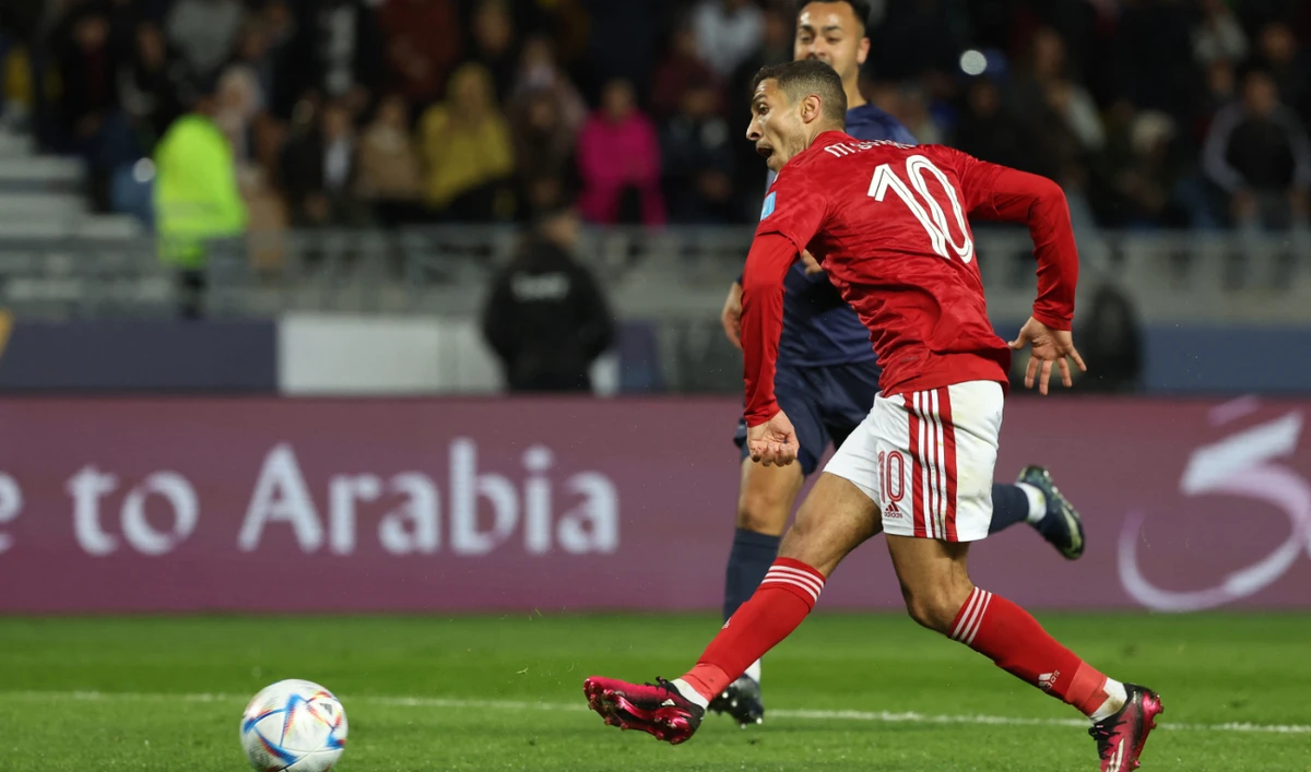 Ahly's forward Mohamed Sherif shoots to score the second goal during the FIFA Club World Cup first round football match against Auckland City at the Ibn Batouta Stadium in Tangier on February 1, 2023. (AFP)