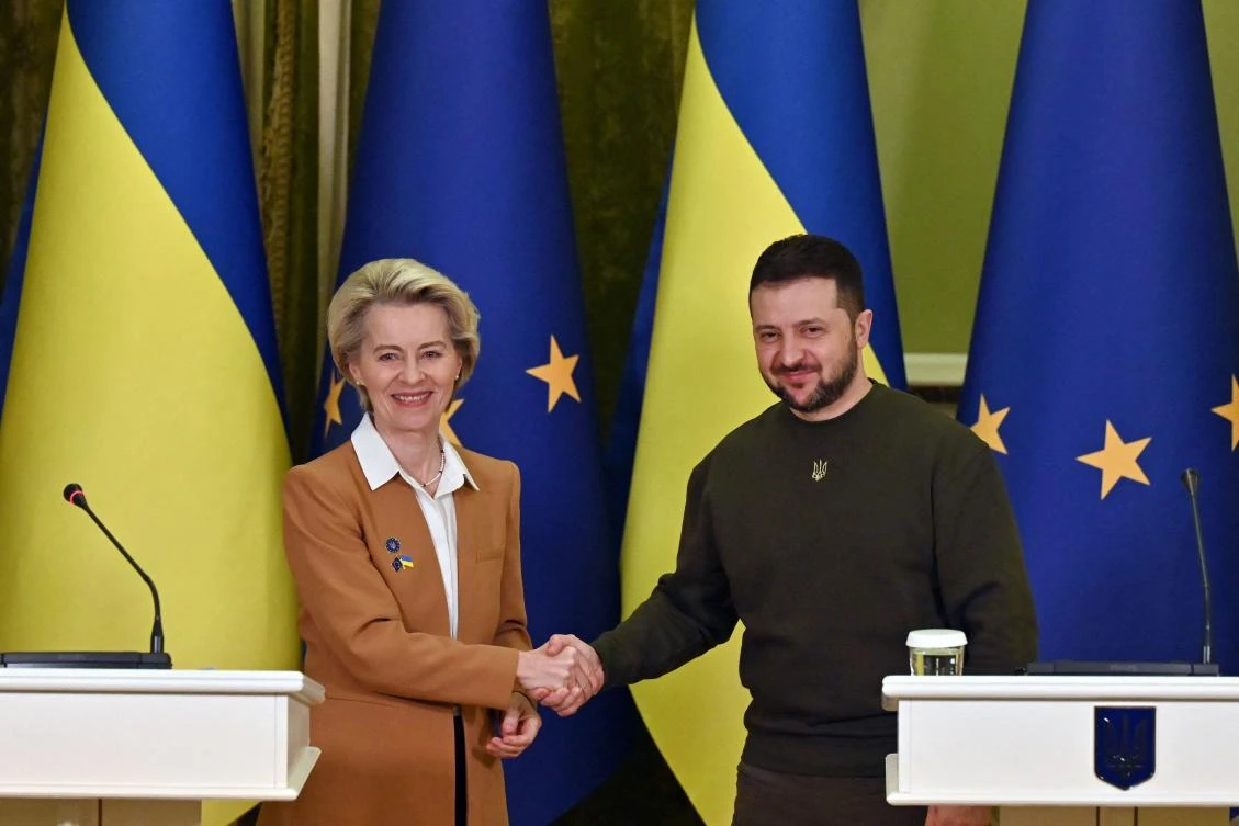 Ukrainian President Volodymyr Zelensky and President of the European Commission Ursula von der Leyen shake hands after a joint press conference after talks in Kyiv on February 2, 2023. (AFP)