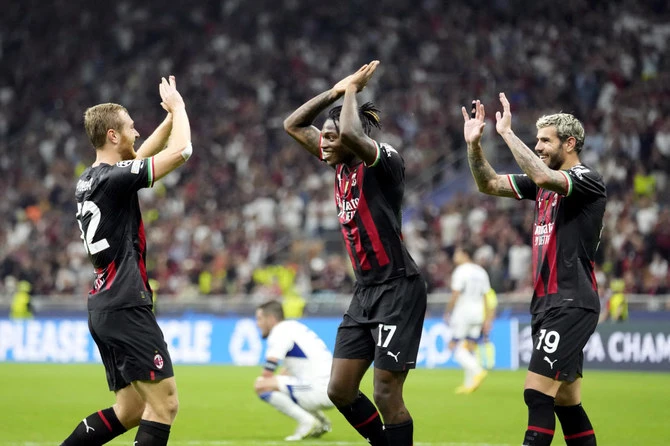 AC Milan’s Tommaso Pobega celebrates with teammates Rafael Leao and Theo Hernandez after scoring his side’s third goal during their Champions League match against Dinamo Zagreb, at the San Siro stadium in Milan in Sep. 2022. (AP/File)