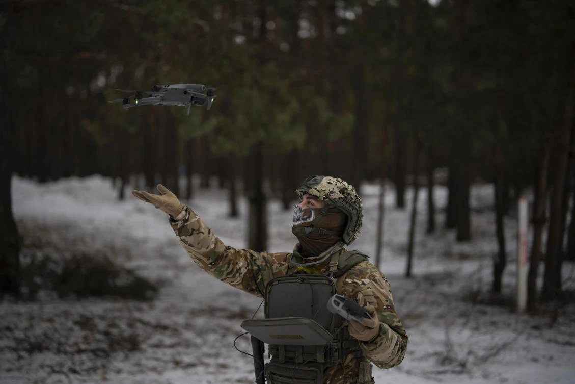 A Ukrainian serviceman lands a drone during a demonstration close to the border with Belarus, Ukraine, on Feb. 1, 2023. (AP)