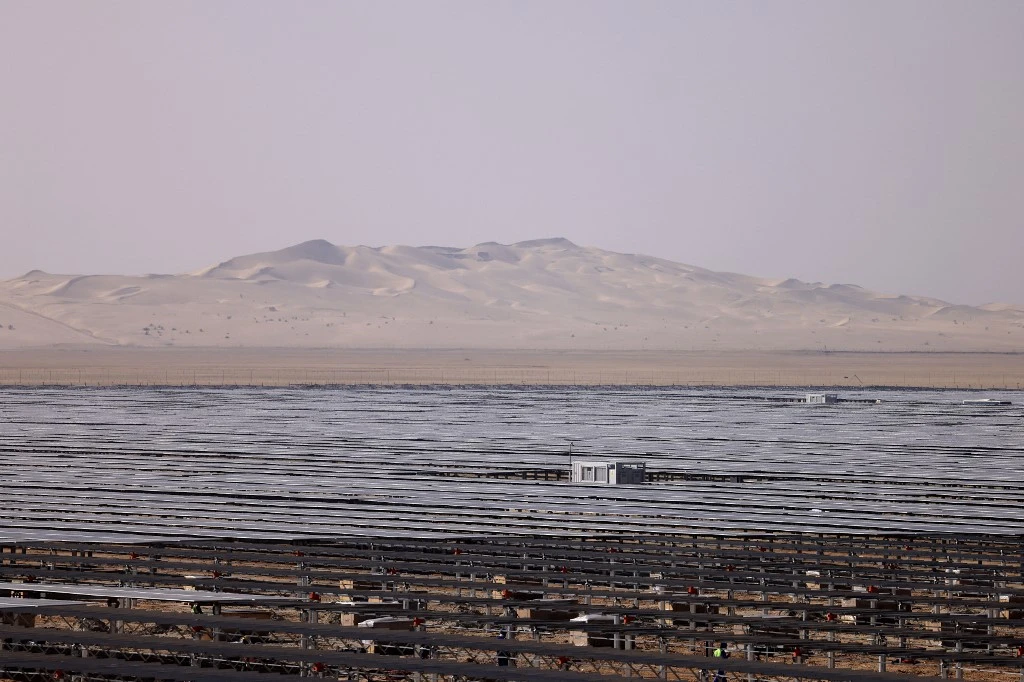The Al-Dhafra Solar Photovoltaic (PV) Independent Power Producer project can be seen in Abu Dhabi, during a visit by the French economy minister on January 31, 2023. (AFP)