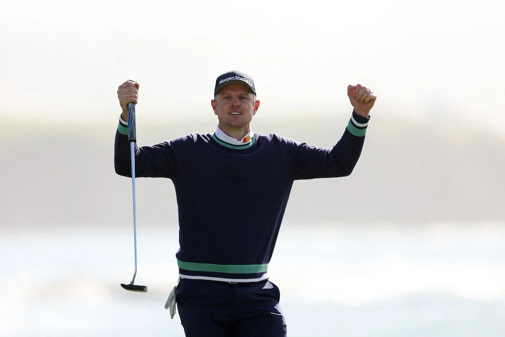 Justin Rose of England celebrates his final putt for victory during the continuation of the final round of the AT&T Pebble Beach Pro-Am at Pebble Beach Golf Links on Monday in Pebble Beach, California. (Getty Images/AFP)