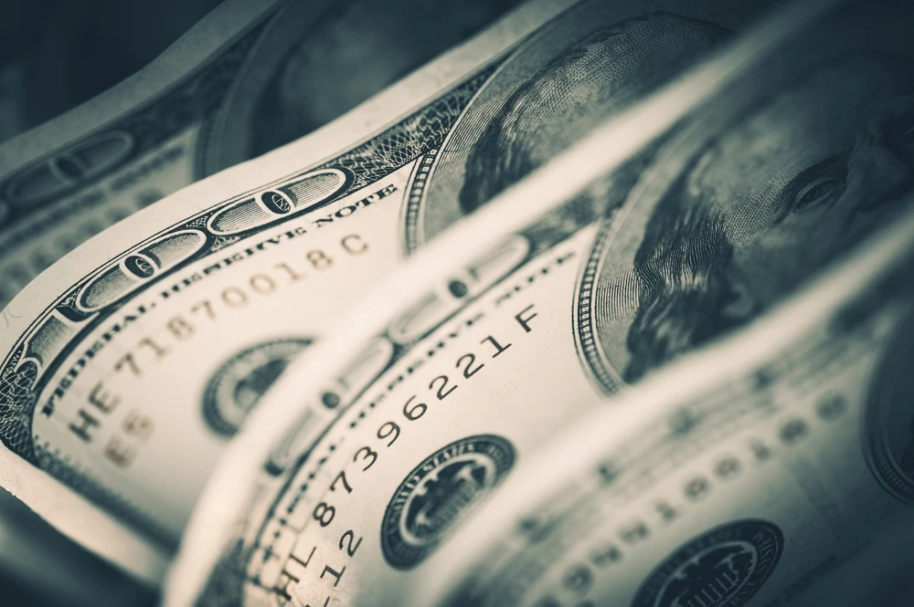 Dollar drops as Fed’s Powell repeats disinflation comments, seen less-hawkish
