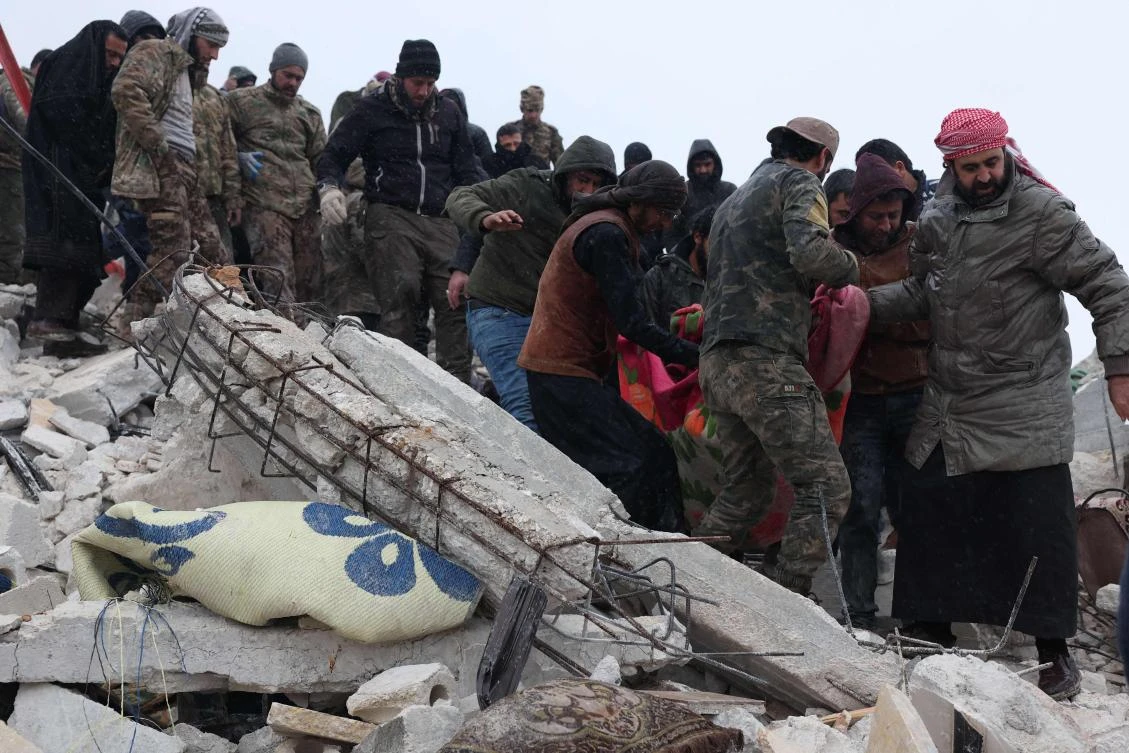 Syrian man digs for 30 relatives buried by quake