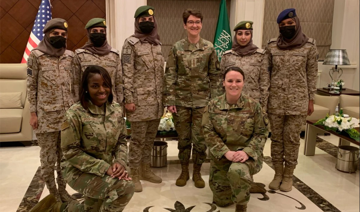 US Air Force Gen. Jacqueline Van Ovost, commander of the US Transportation Command, interacts with female members of the Saudi Arabian Armed Forces. (Supplied)