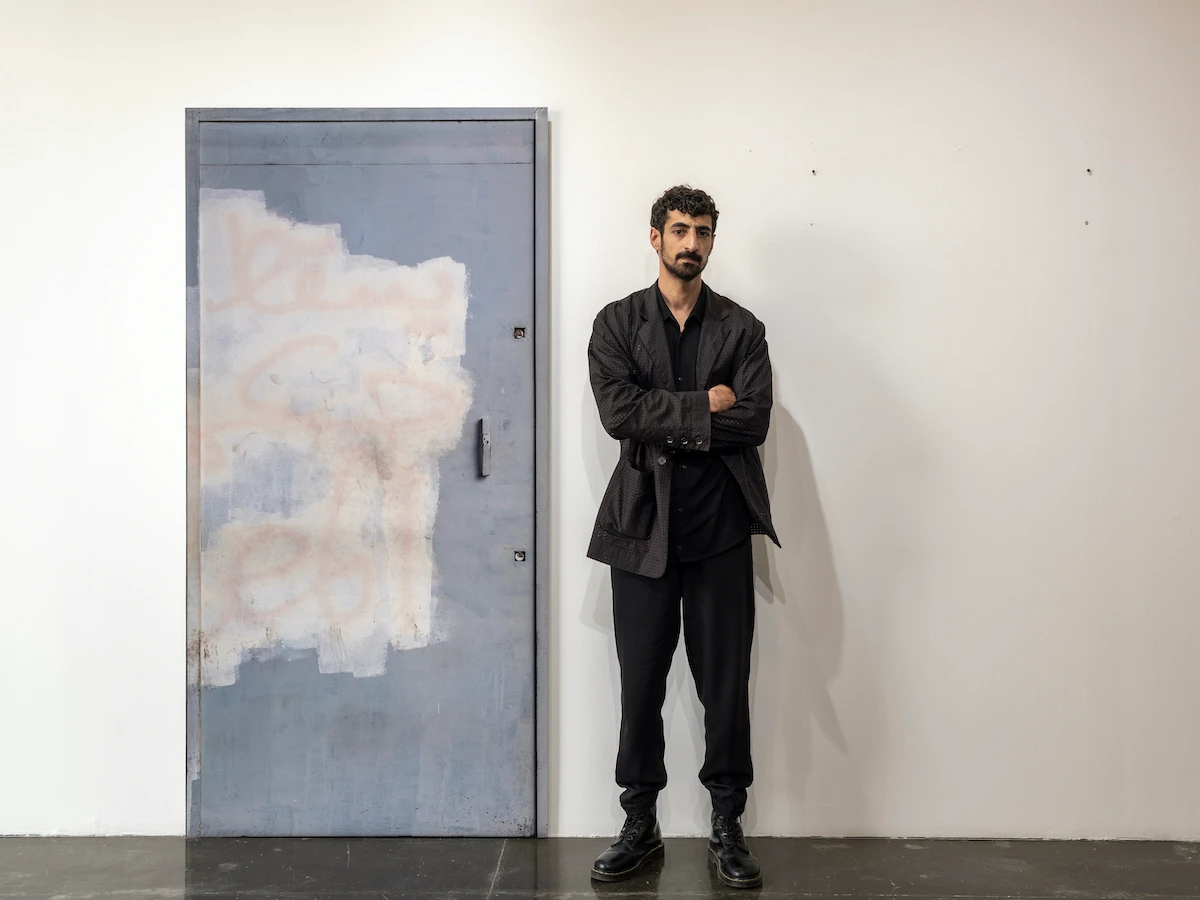 Dia Mrad standing by his work ‘Portal 1,’ part of his ‘Utilities’ exhibition. (Supplied)