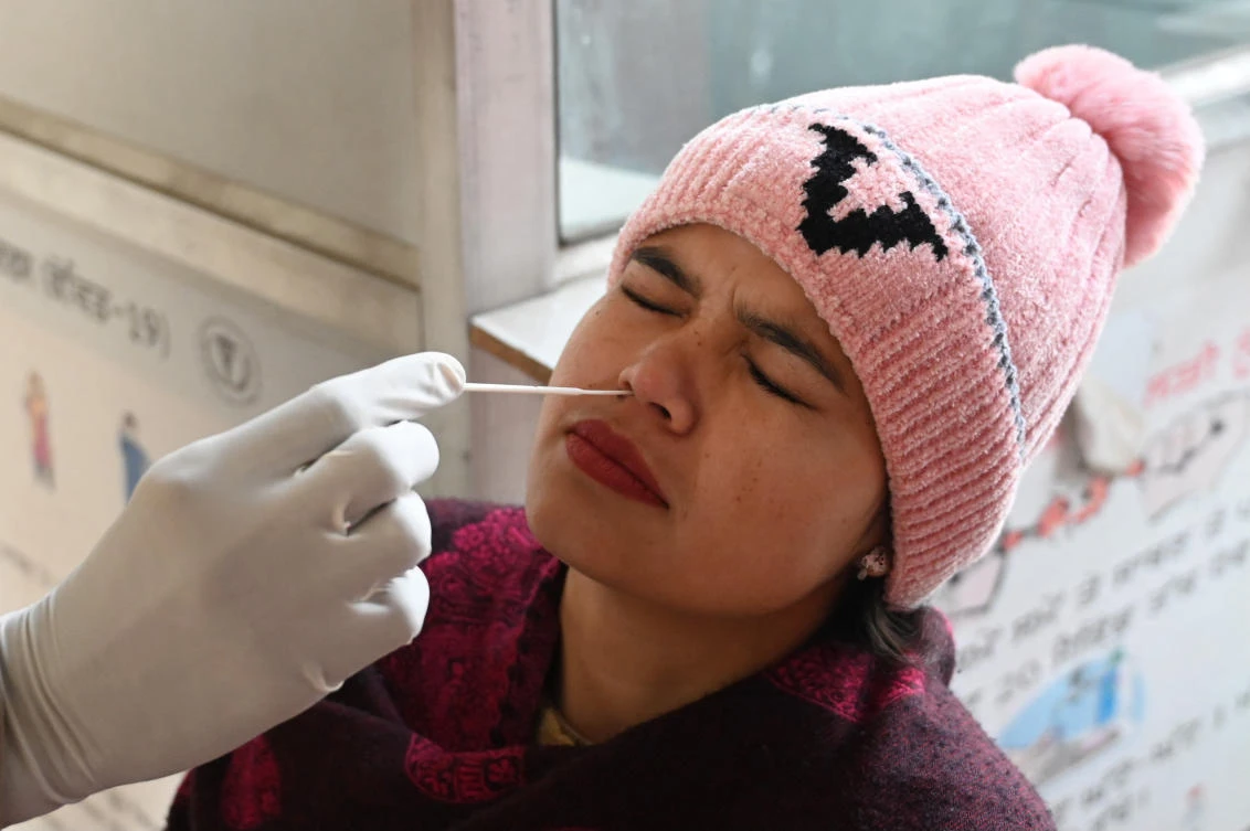 The random testing of 2 percent of all travelers landing in India will continue, the health ministry wrote in the letter dated Feb. 9 to the civil aviation ministry. (File/AFP)