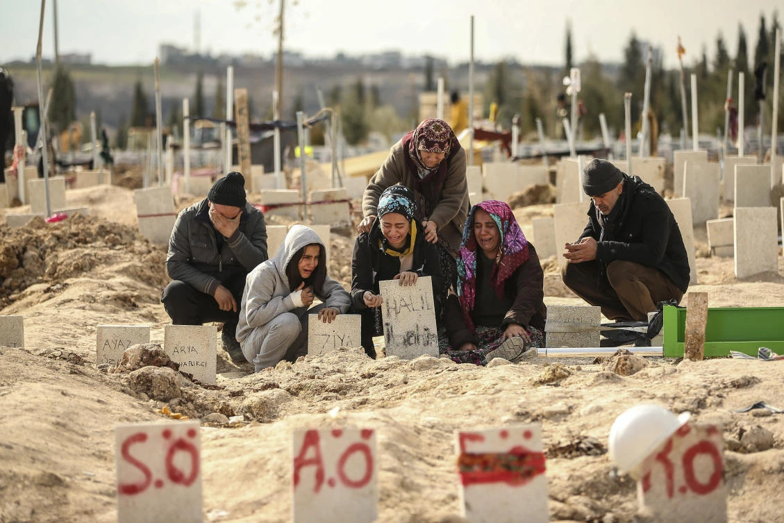 People at the cemetery as they bury their loved ones, victims of Monday earthquake, in Adiyaman, Turkiye, on Feb. 10, 2023. (AP)