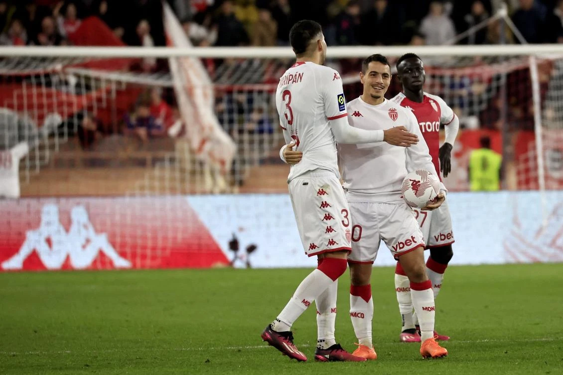 Monaco’s French forward Wissam Ben Yedder and teammates Chilean Guillermo Maripan and Senegalese Krepin Diatta celebrate after winning their French L1 match against PSG at the Louis II stadium in Monaco on Feb, 11, 2023. (AFP)