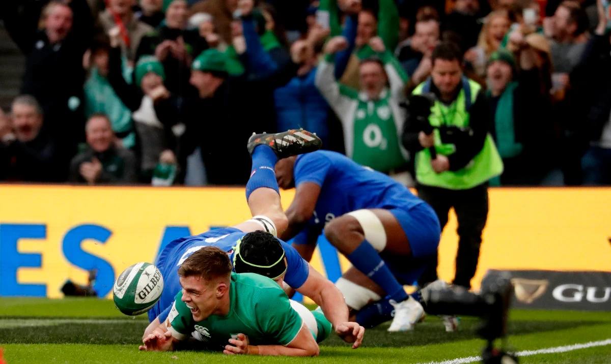 Ireland's Garry Ringrose, left, scores a try during the Six Nations rugby union international match between Italy and France, at Aviva Stadium in Dublin Saturday. (AP)