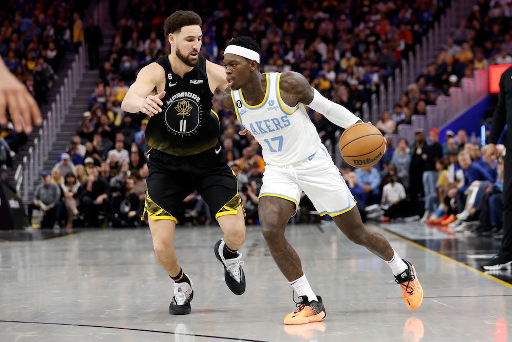 Los Angeles Lakers guard Dennis Schroder drives to the basket against Golden State Warriors guard Klay Thompson during their NBA basketball game in San Francisco Saturday. (AP)