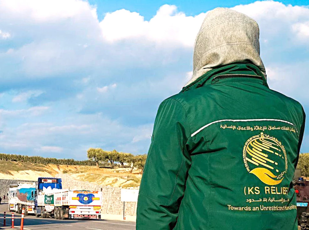 The trucks carry 104 tons of food and shelter materials to be distributed to the victims of the natural disaster in Syria. (SPA)
