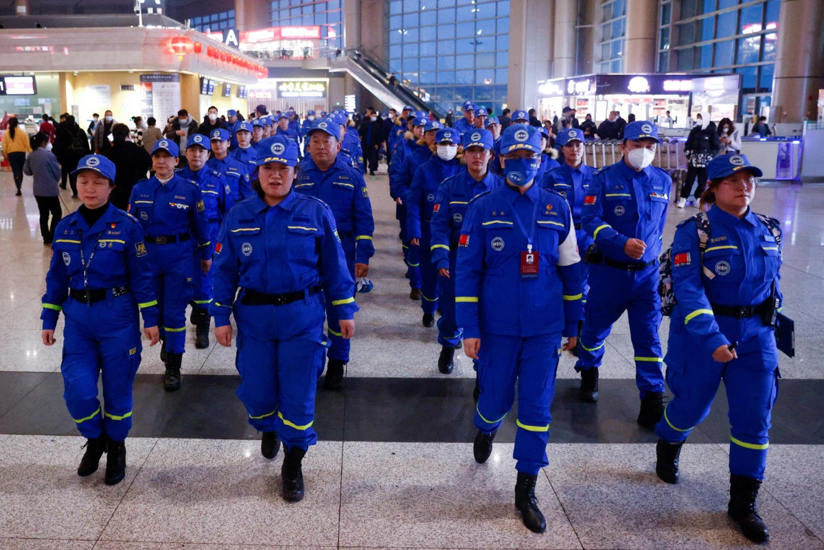 Blue Sky Rescue (BSR) personnel prepare to depart from Wuhan Tianhe International Airport in Wuhan, central China's Hubei Province, on Feb. 8, 2023, for quake-hit Turkiye to help search and rescue efforts. (EPA/XINHUA)