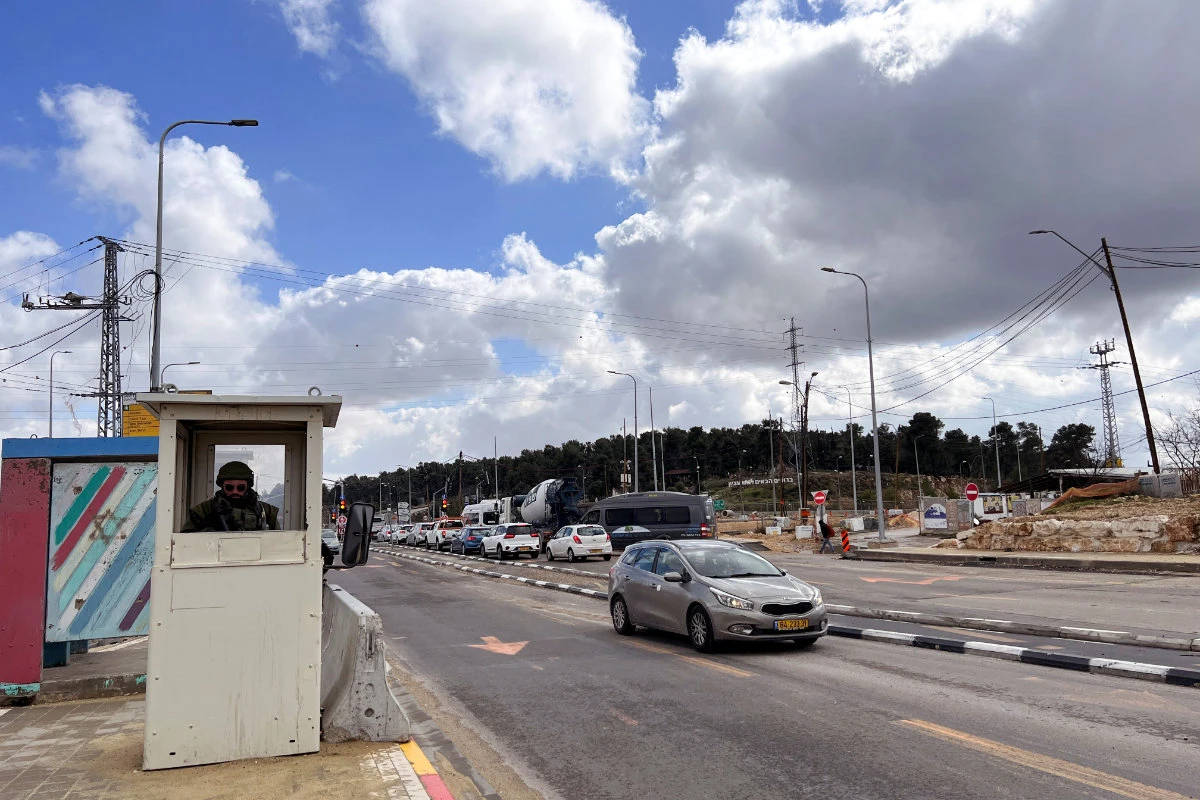 An Israeli soldier stands guard at Gush Etzion Junction in the Gush Etzion settlements compound in the Israeli-occupied West Bank on Feb. 2, 2023. (REUTERS/Dedi Hayun)