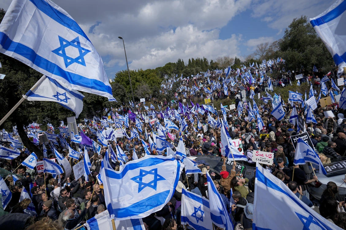 The protest outside the Knesset was the largest in years and reflected the deep divisions over Prime Minister Benjamin Netanyahu’s plan. (AP)