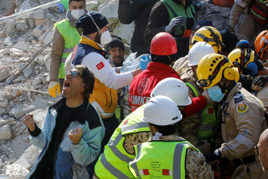 A son of a Turkish woman reacts as his mother is rescued after 177 hours, at the site of a collapsed building in the aftermath of a deadly earthquake in Hatay, Turkey February 13, 2023. (Reuters)