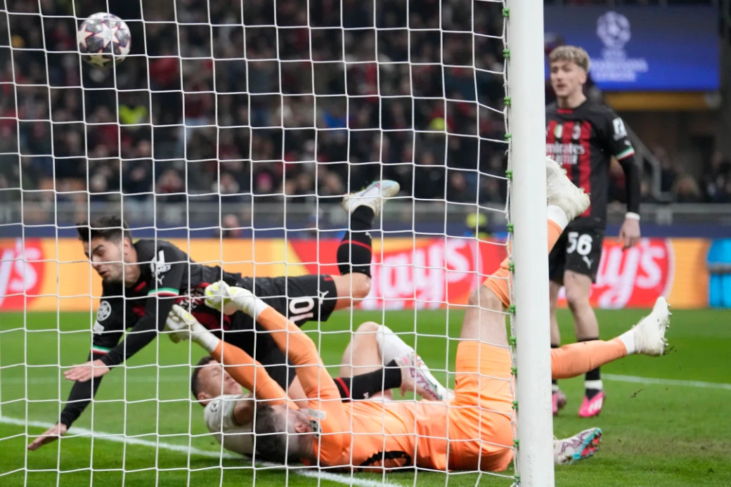 Tottenham's goalkeeper Fraser Forster fails to save the ball as AC Milan's Brahim Diaz, top left, scores his side's opening goal during their Champions League round of 16 first leg soccer match at the San Siro stadium in Milan Tuesday. (AP)