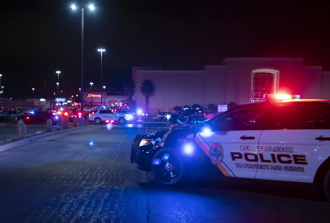 Police cars block the vehicles access to a shopping mall. Police say one person was killed and three other people were wounded in a shooting at Cielo Vista Mall. (AP)