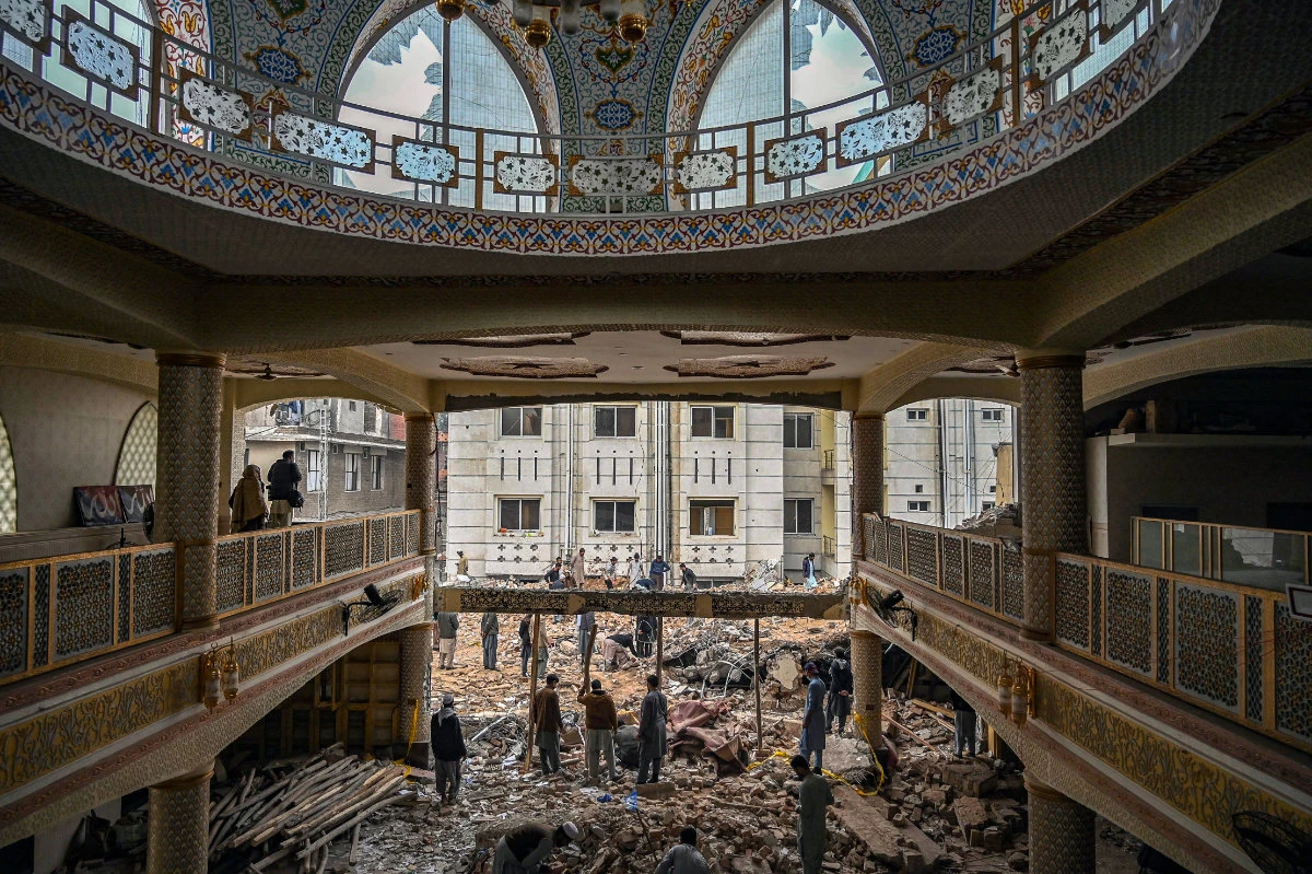 Investigators scour the rubble of a mosque inside the police headquarters in Peshawar after a suicide blast killed more than 100 people on February 1, 2023. (AFP)