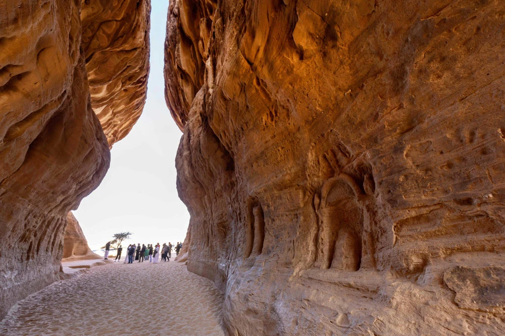 Tourists visit the Nabataean archaeological site of al-Hijr (Hegra), near the northwestern Saudi city of Al-Ula. (AFP file photo)
