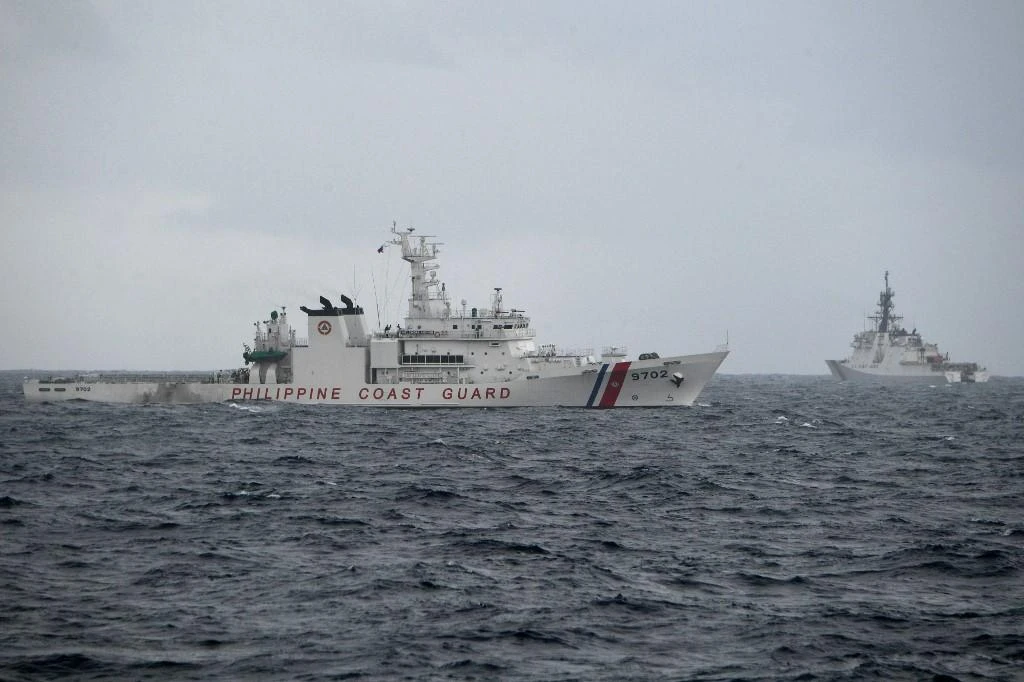 Philippine coast guard ship Melchora Aquino, left, and US coast guard cutter Midgett maneuver during an exercise in the vicinity of the South China sea on Sept. 3, 2022. (AFP)