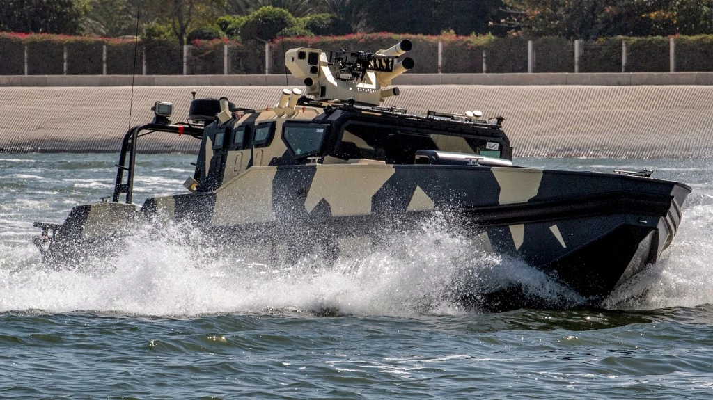 A Chaser multi-purpose combat boat performs maneuvers during a demonstration at the Naval Defence and Maritime Security Exhibition (NAVDEX), part of the wider International Defence Exhibtion (IDEX) at the Abu Dhabi International Exhibition Centre on Feb. 20, 2023. (Ryan LIM / AFP)