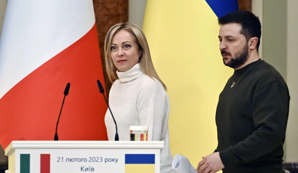 Ukrainian President Volodymyr Zelensky (R) and Italian Prime Minister Giorgia Meloni (L) arrive to joint press conference after their meeting in Kyiv on February 21, 2023, amid the Russian invasion of Ukraine. (AFP)