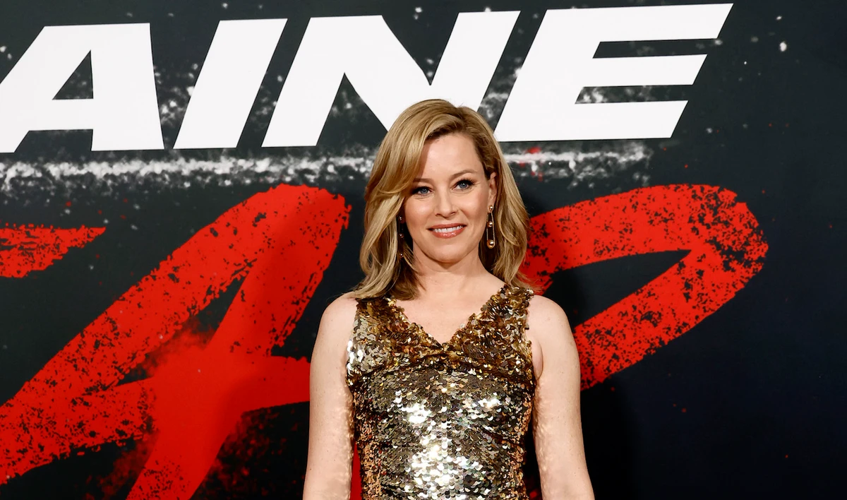 The star wore a sequin-embellished minidress with side draped panels. (Getty Images)