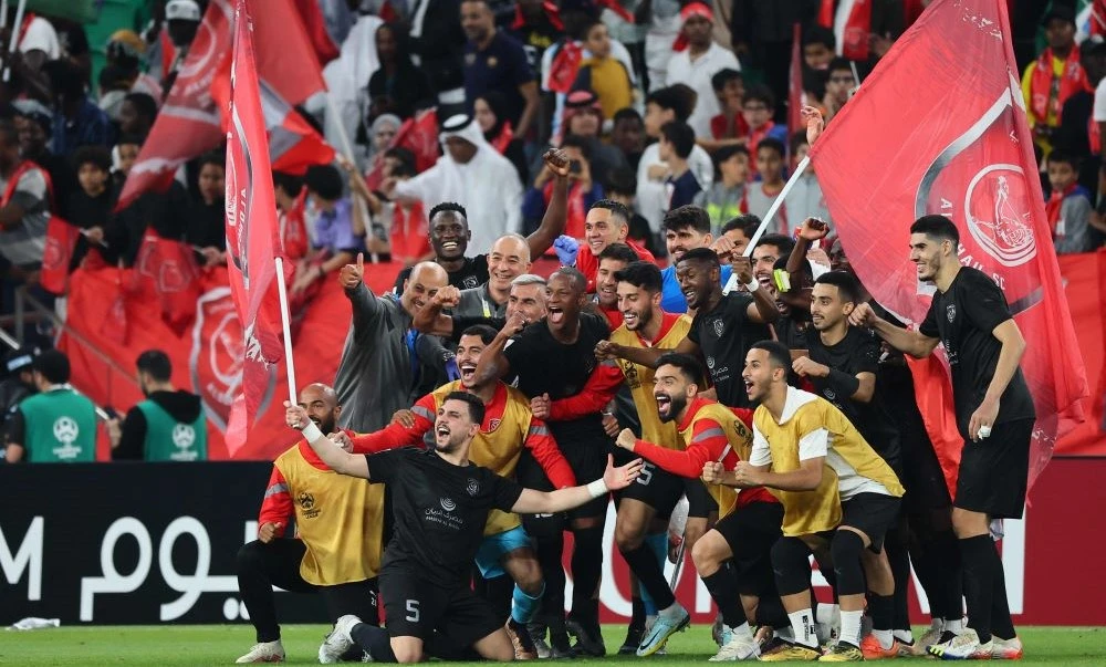 Al-Duhail’s players celebrate with their supporters after their AFC Champions League quarter-final win over Al-Shabab at Al-Thumama Stadium in Doha on February 23, 2023. (AFP)