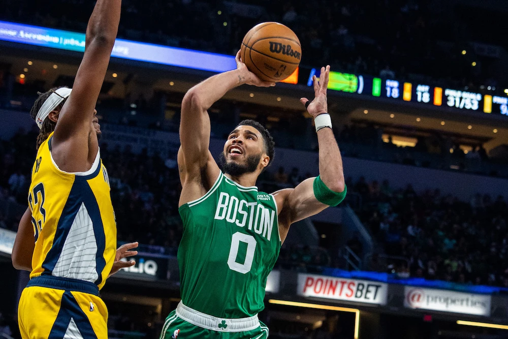 Boston Celtics forward Jayson Tatum shoots the ball while Indiana Pacers center Myles Turner (33) defends in the second half of an NBA game at Gainbridge Fieldhouse Thursday. (USA TODAY Sports)
