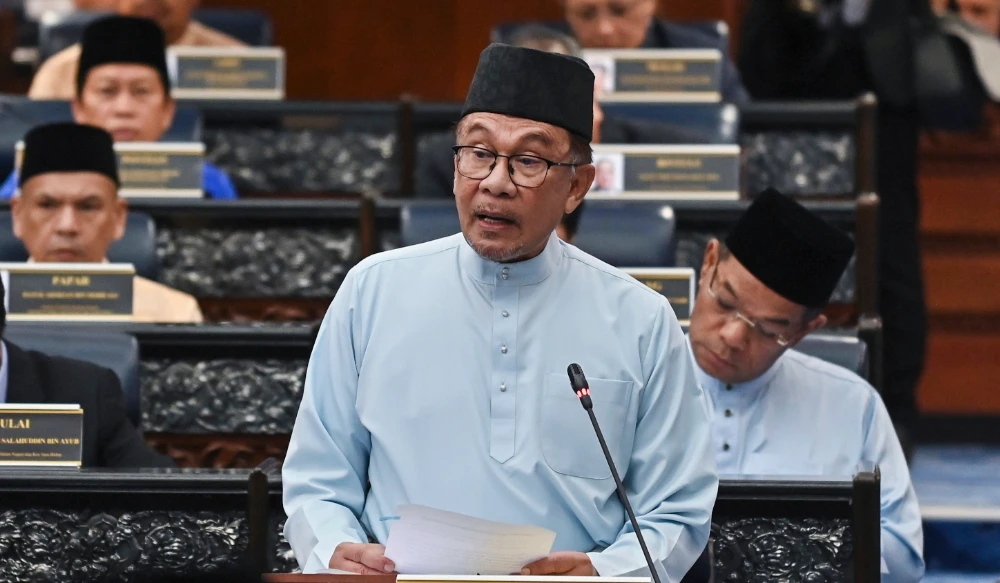Prime Minister and Finance Minister Anwar Ibrahim delivers his 2023 budget speech at the parliament in Kuala Lumpur Friday. (Malaysia’s Department of Information via AP)