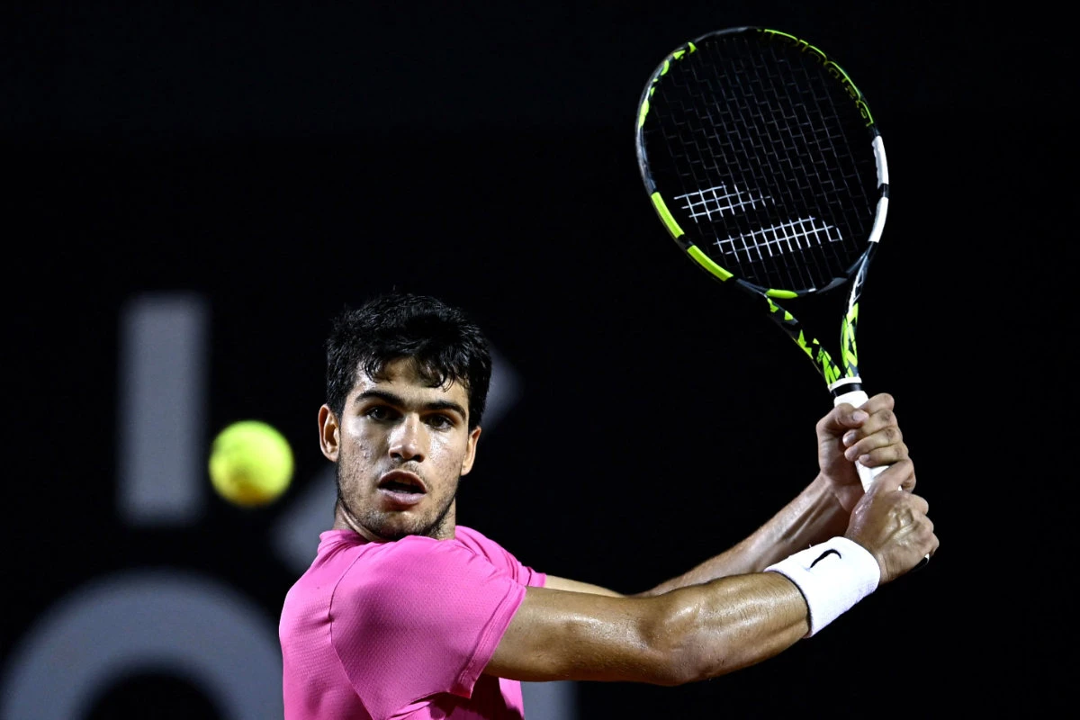 Spain's Carlos Alcaraz returns the ball during the ATP 500 Rio Open singles tennis quarterfinal match against Serbia's Dusan Lajovic in Rio de Janeiro, Brazil, on Feb. 24, 2023. (AFP)