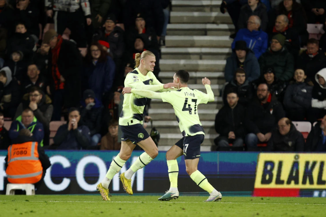 Manchester City’s Phil Foden celebrates with Erling Haaland after scoring his side’s third goal during their Premier League match against Bournemouth at the Vitality Stadium in Bournemouth, on Feb. 25, 2023. (AP)