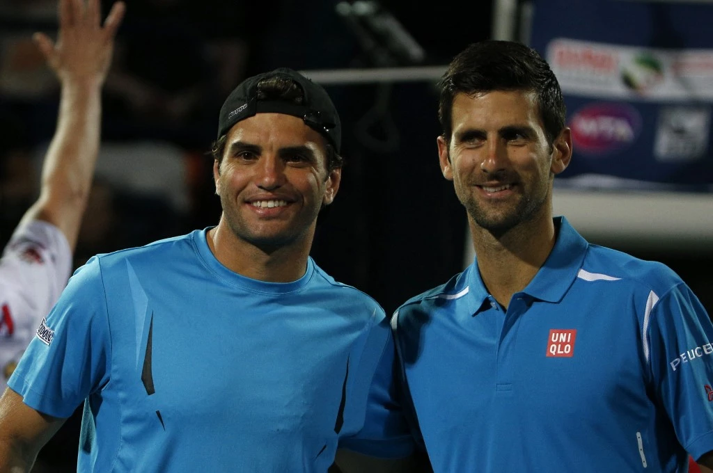 Tunisian Malek Jaziri and Novak Djokovic of Serbia pose for a picture after the latter’s win during an ATP tennis match. (File/AFP)