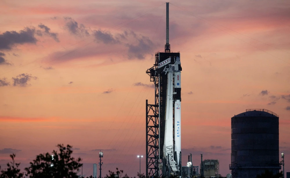 In this handout provided by the US National Aeronautics and Space Administration (NASA), A SpaceX Falcon 9 rocket with the company's Dragon spacecraft on top is seen at sunset on the launch pad at Launch Complex 39A as preparations continue for the Crew-6 mission, February 25, 2023, at NASA’s Kennedy Space Center in Florida. (AFP)