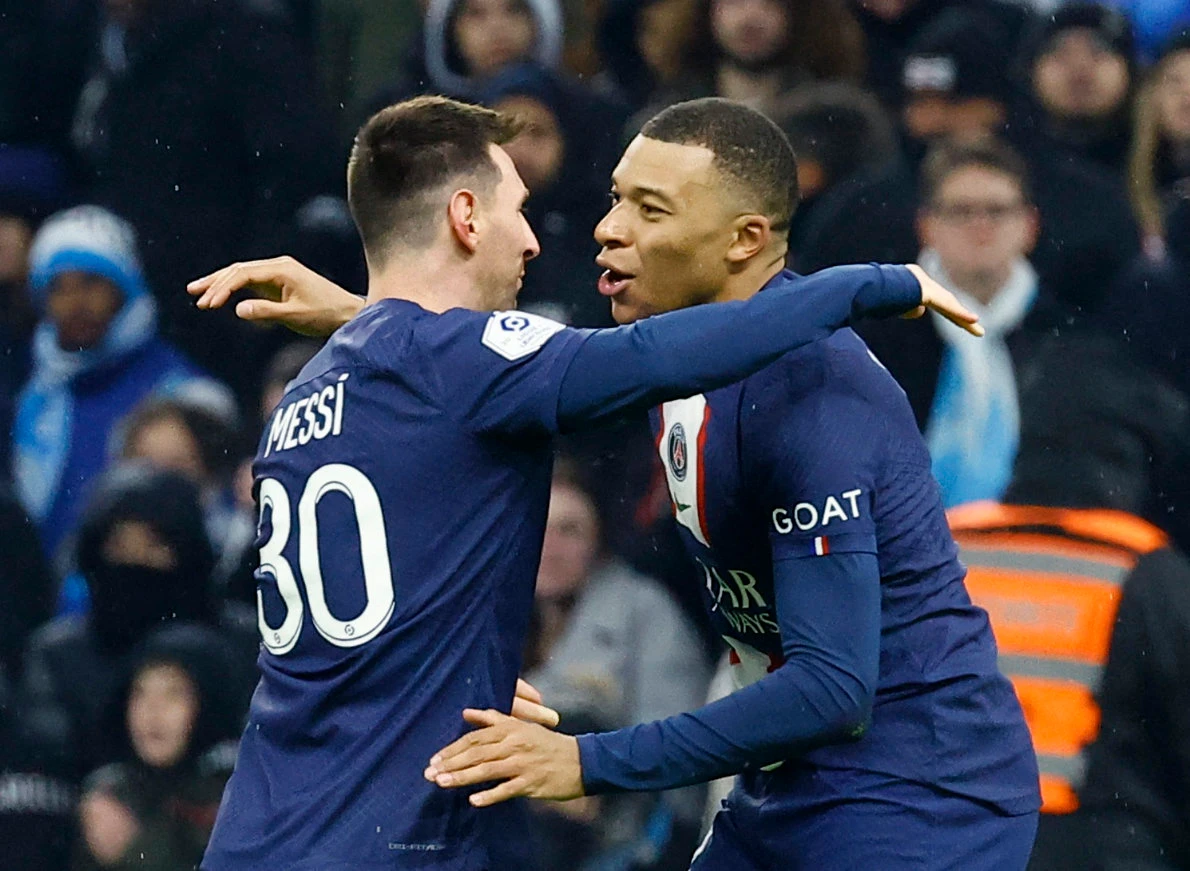 Paris St Germain's Kylian Mbappe celebrates scoring their third goal with Lionel Messi against Olympique de Marseille on February 26, 2023. (Reuters)