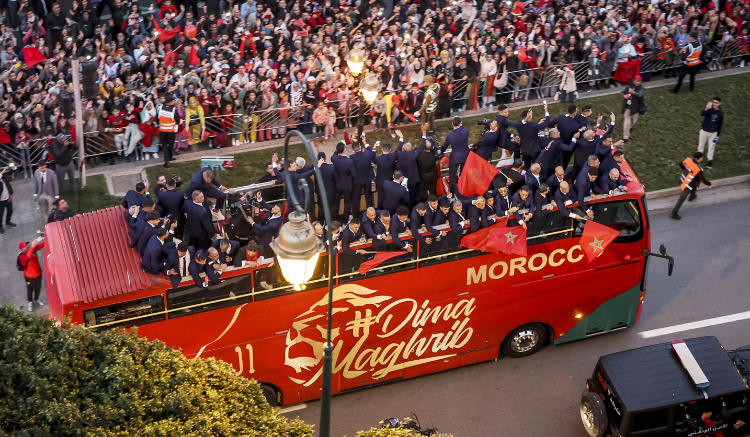 Supporters cheer as Morocco's national football team arrives to the center of the capital Rabat. (AFP)